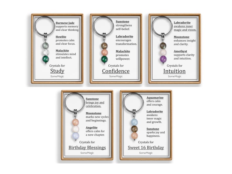 May include: Keychains with crystal beads in various colors, each with a different purpose. The keychains are displayed on cards with text such as "Study", "Confidence", "Intuition", "Birthday Blessings", and "Sweet 16 Birthday".