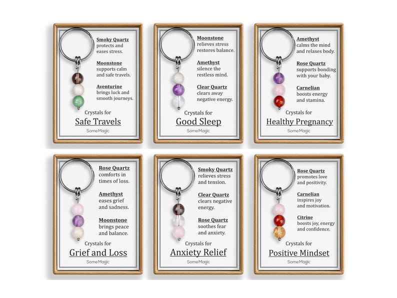 May include: Six keychains with crystal beads in various colors, each on a card with text. The keychains are labeled for Safe Travels, Good Sleep, Healthy Pregnancy, Grief and Loss, Anxiety Relief, and Positive Mindset.