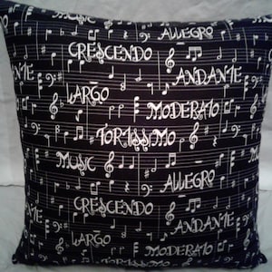 May include: Black and white throw pillow with a musical note pattern. The pillow features musical terms like "Allegro", "Crescendo", "Largo", "Andante", and "Moderato".