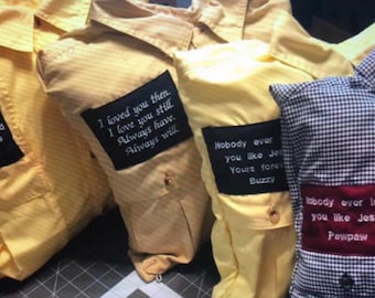 May include: Four yellow and blue plaid shirts with embroidered patches. The patches have different messages, including "Nobody ever loved you like Jesus Pawpaw" and "I loved you then. I love you still. Always have. Always will."