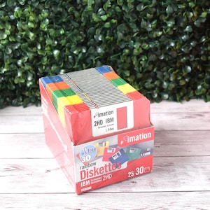 May include: A box of Imation rainbow diskettes, 2HD IBM formatted, with 30 disks. The box is red with colorful diskettes visible on top. The text "Diskettes" is printed on the box.