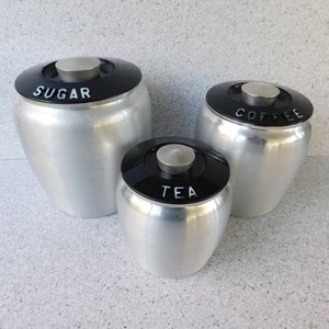 Set of 3 Mid Century Aluminum Kromex Canisters, Sugar Canister, Coffee Canister, Tea Canister, Spun Aluminum with Black Lids