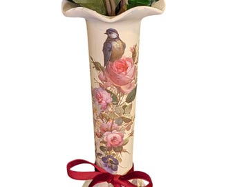 Hand-painted vase Including floral arrangement and decorative ribbon.