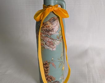 Ceramic vase including floral arrangement.