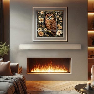 a cozy living room with a fireplace, a framed artwork of an owl, and a comfortable couch and chair arrangement.