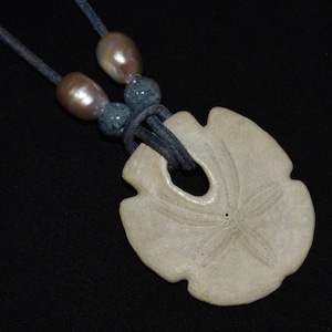 Beautiful Fossilized Sand Dollar Pendant on a Blue Leather Cord with Accent Beads