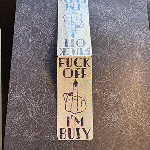 May include: A glittery sticker with a middle finger and the text "F**k Off I'm Busy".