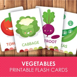 May include: Printable flashcards featuring colorful illustrations of vegetables with cute faces. The cards include a tomato, cabbage, beetroot, and peas. Each card has the name of the vegetable printed below the image.
