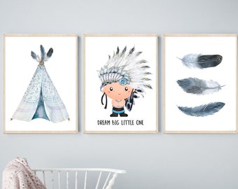 May include: Three framed prints with a blue and white color scheme. The first print features a blue and white teepee, the second print features a cartoon character wearing a blue and white headdress with the text "Dream Big Little One", and the third print features three blue and white feathers.