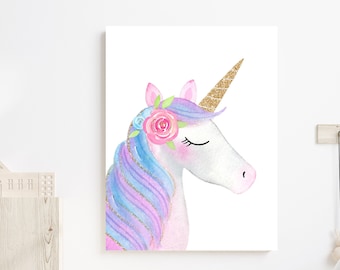 May include: A watercolor painting of a unicorn's head with a pink flower crown and a gold horn. The unicorn has a pink and purple mane and is set against a white background.