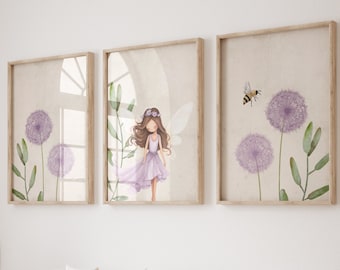 May include: Three framed prints with a watercolor illustration of a fairy with wings and a purple dress, and dandelions with a bee. The prints are hanging on a white wall above a white daybed with a beige blanket and pillows.