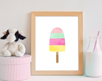 May include: A framed print of a watercolor popsicle with yellow, pink, and green stripes on a white background.