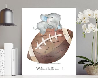 May include: A watercolor illustration of a baby shower guest book. A cute gray elephant sits on top of a brown football. The football is surrounded by names written in brown ink. The text "Welcome little one!!!" is written below the football.
