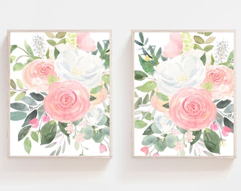 May include: Two framed watercolor prints of pink and white flowers with green leaves. The prints are in a simple, modern style and would look great in any home.