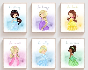 May include: Six printable wall art prints featuring cartoon princesses with different colored dresses and hair. Each print has a watercolor background and the text "be [adjective]" at the top. The adjectives are strong, happy, kind, smart, silly, and curious.