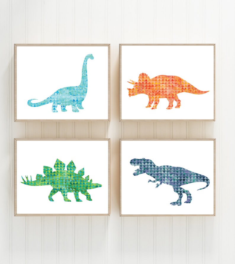 May include: Set of four watercolor dinosaur prints in a geometric pattern. The prints feature a blue brachiosaurus, an orange triceratops, a green stegosaurus, and a blue T-Rex.