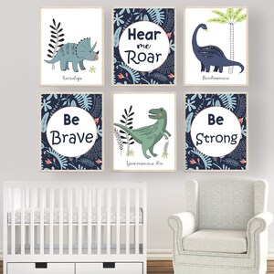 May include: Six framed prints with blue and green dinosaur illustrations and motivational text. The prints feature a Triceratops, Brachiosaurus, Tyrannosaurus Rex, and the phrases "Hear me Roar", "Be Brave", and "Be Strong".