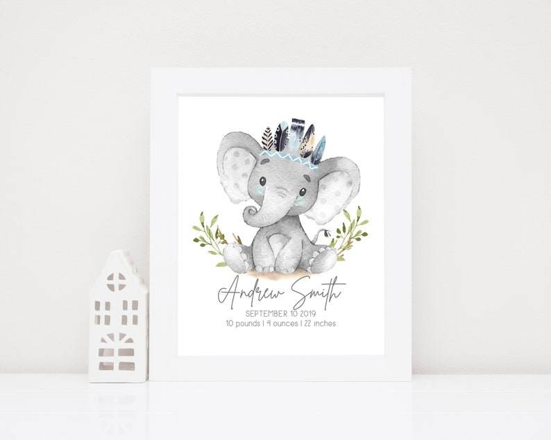 May include: A watercolor illustration of a gray elephant wearing a blue and black feathered headdress. The elephant is sitting on a bed of green leaves. The text "Andrew Smith" is written below the elephant, along with the date "September 10, 2019" and the baby's weight and length: "10 pounds 14 ounces | 22 inches".