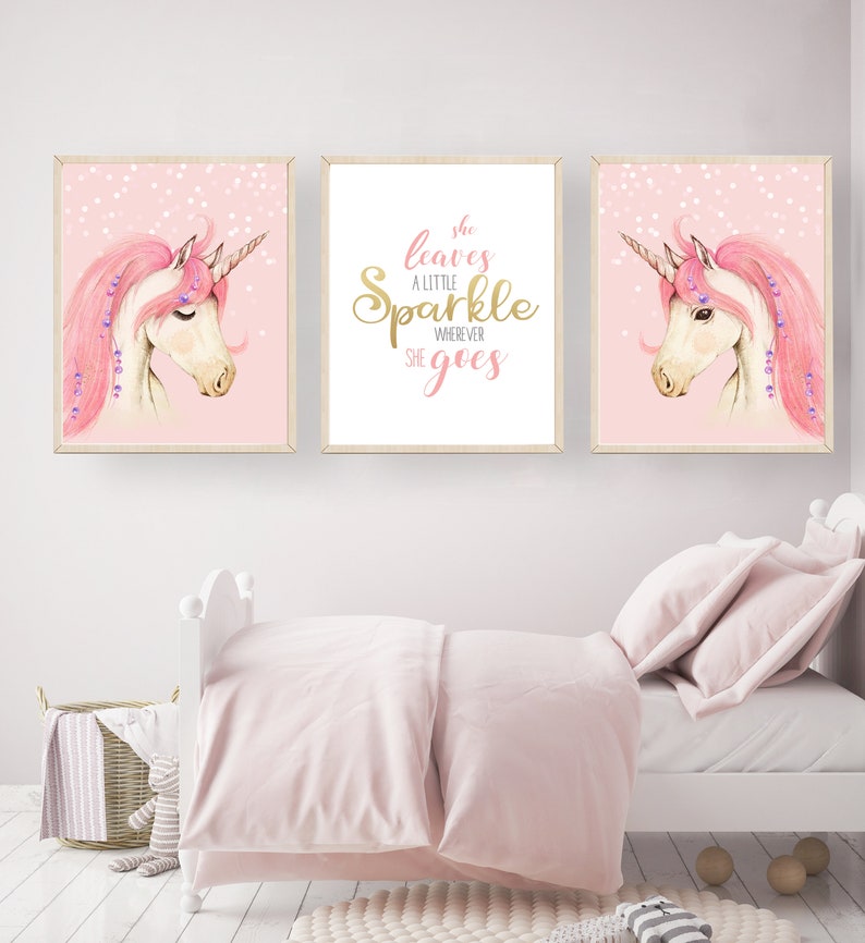 May include: Three pink and white unicorn illustrations with gold glitter accents. The centre illustration features the text "She leaves a little sparkle wherever she goes".