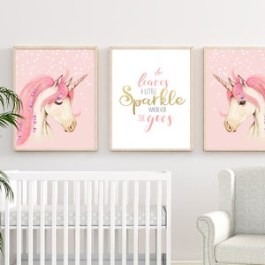 May include: Three pink and white unicorn nursery prints with gold glitter accents. The centre print features the text "She leaves a little sparkle wherever she goes".