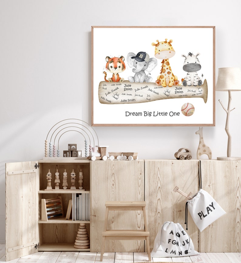 May include: A watercolor illustration of a baseball bat with a tiger, elephant, giraffe, and zebra sitting on it. The bat has the words "Dream Big Little One" written on it. There is a baseball on the bat.