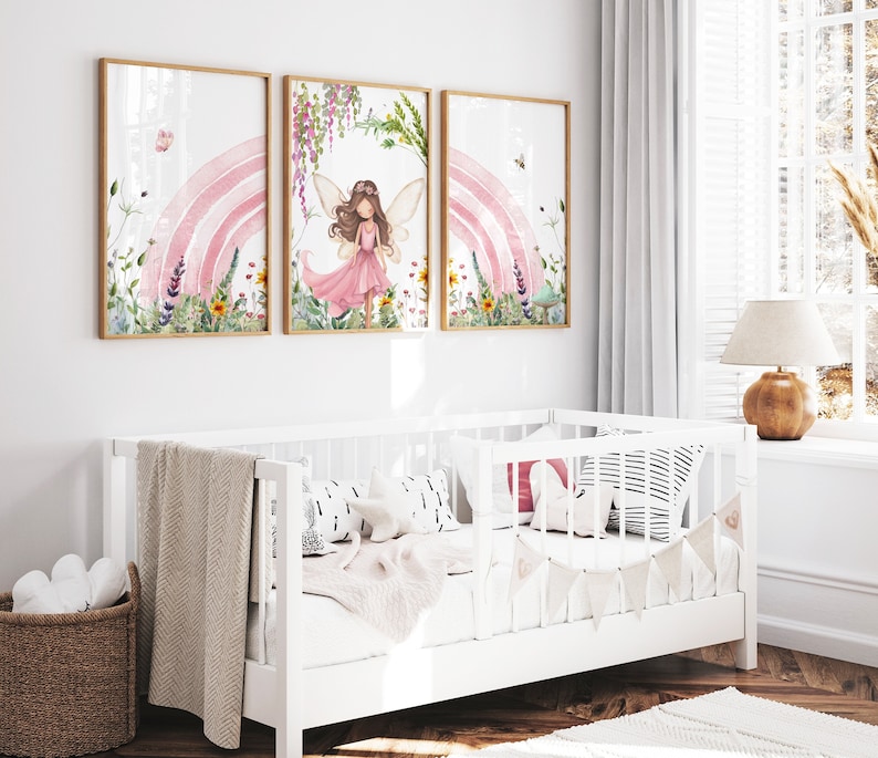 May include: Three framed watercolor illustrations of a fairy with pink wings and a pink dress standing in front of a pink rainbow with flowers and greenery.