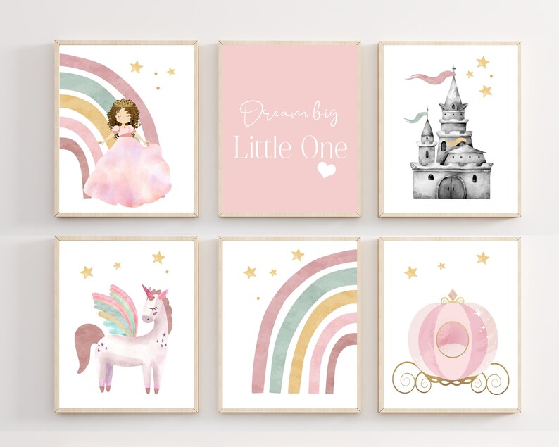 May include: Set of six watercolor prints featuring a princess, a unicorn, a castle, a carriage, and two rainbows with stars. The prints have a pink, gold, and green color scheme and the text "Dream big Little One".