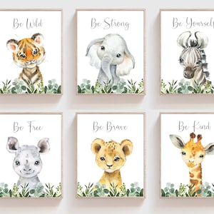 May include: Set of six watercolor prints featuring jungle animals with inspirational messages. Each print features a different animal, including a tiger, elephant, zebra, rhinoceros, lion, and giraffe. The prints are framed in a simple wooden frame and have a white background.