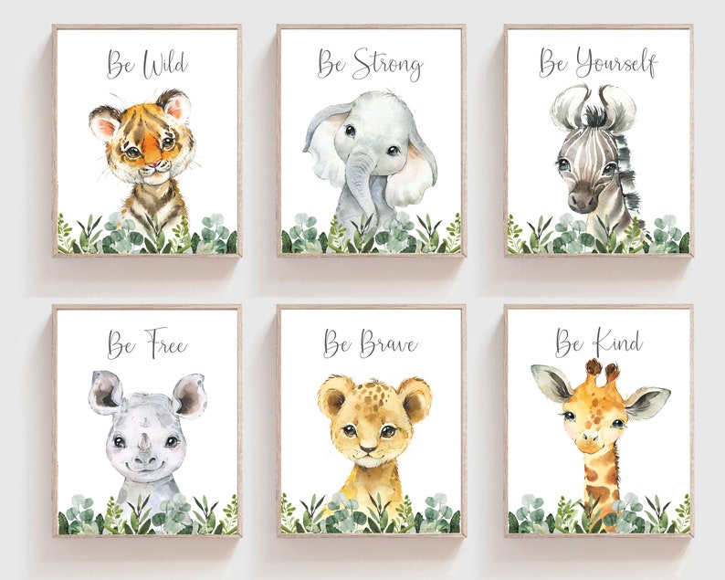 May include: Set of six watercolor prints featuring jungle animals with inspirational messages. Each print features a different animal, including a tiger, elephant, zebra, rhinoceros, lion, and giraffe. The prints are framed in a simple wooden frame and have a white background.