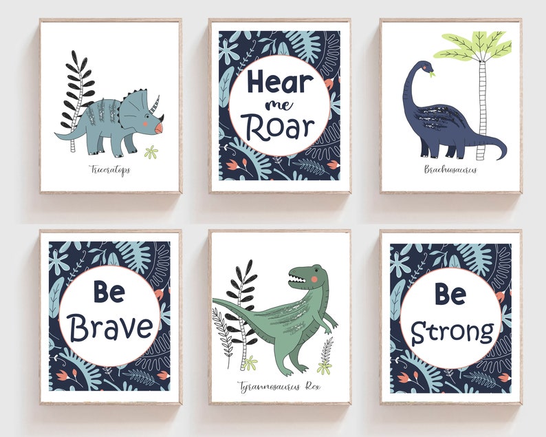 May include: Set of six blue and green dinosaur themed nursery prints with motivational phrases. The prints feature illustrations of dinosaurs, including a Triceratops, Brachiosaurus, and Tyrannosaurus Rex. The phrases on the prints include "Hear me Roar", "Be Brave", and "Be Strong".