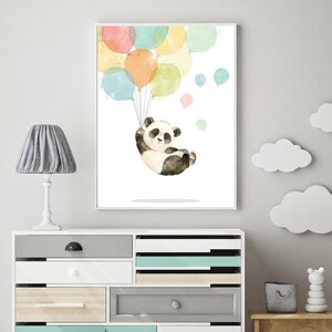 May include: A watercolor illustration of a panda bear holding onto colorful balloons. The panda is wearing a white shirt and black pants. The balloons are in shades of pink, yellow, blue, and green.