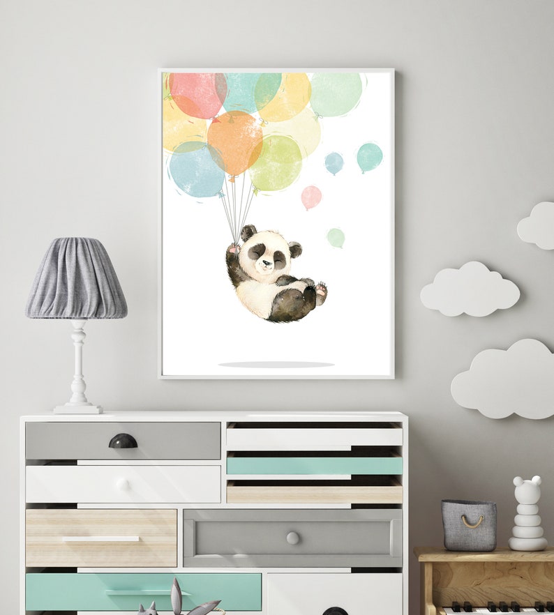 May include: A watercolor illustration of a panda bear holding onto colorful balloons. The panda is wearing a white shirt and black pants. The balloons are in shades of pink, yellow, blue, and green.