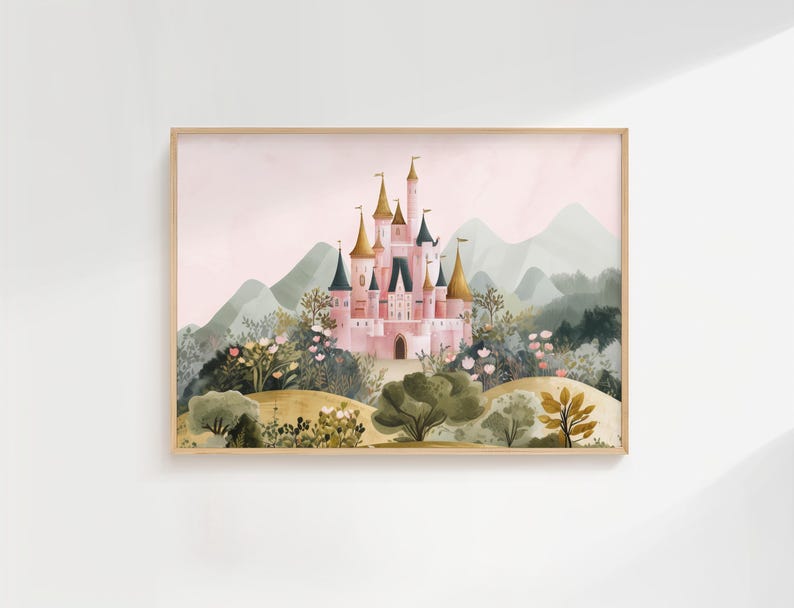 May include: Watercolor painting of a pink castle with gold turrets, set against a backdrop of green mountains and a soft pink sky. The castle is surrounded by lush greenery and flowers, framed in a light wood.
