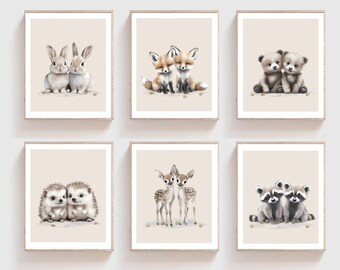 May include: Set of six printable nursery art prints featuring pairs of cute woodland animals. The prints feature a pair of bunnies, foxes, bears, hedgehogs, deer, and raccoons. Each print has a beige background.