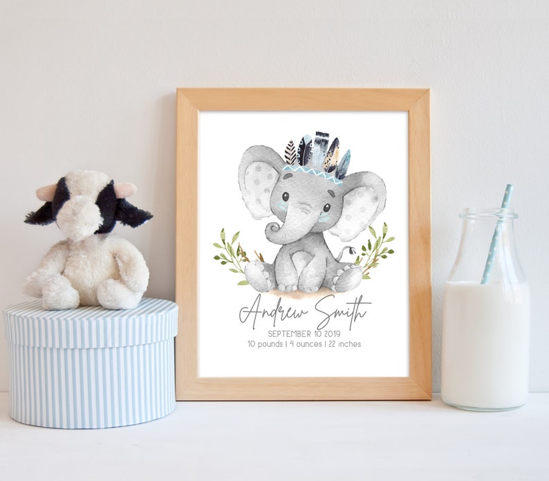 May include: A watercolor illustration of a gray elephant wearing a blue and brown feather headdress. The elephant is sitting on a white background with green leaves. The text "Andrew Smith, September 10, 2019, 10 pounds 14 ounces | 22 inches" is below the elephant.