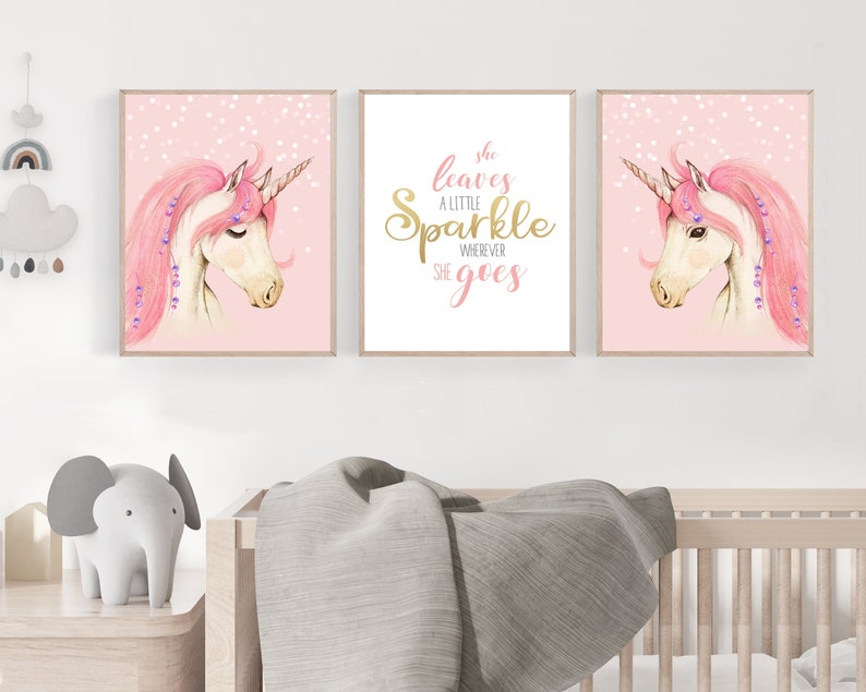 May include: Three pink and white unicorn illustrations with gold glitter accents. The centre illustration features the text "She leaves a little sparkle wherever she goes".