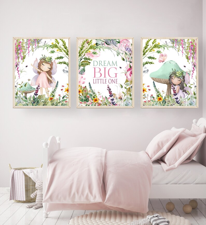 May include: Three framed prints with a white background and floral designs. Each print features a fairy with wings and a flower crown. The middle print has the text "Dream Big Little One".