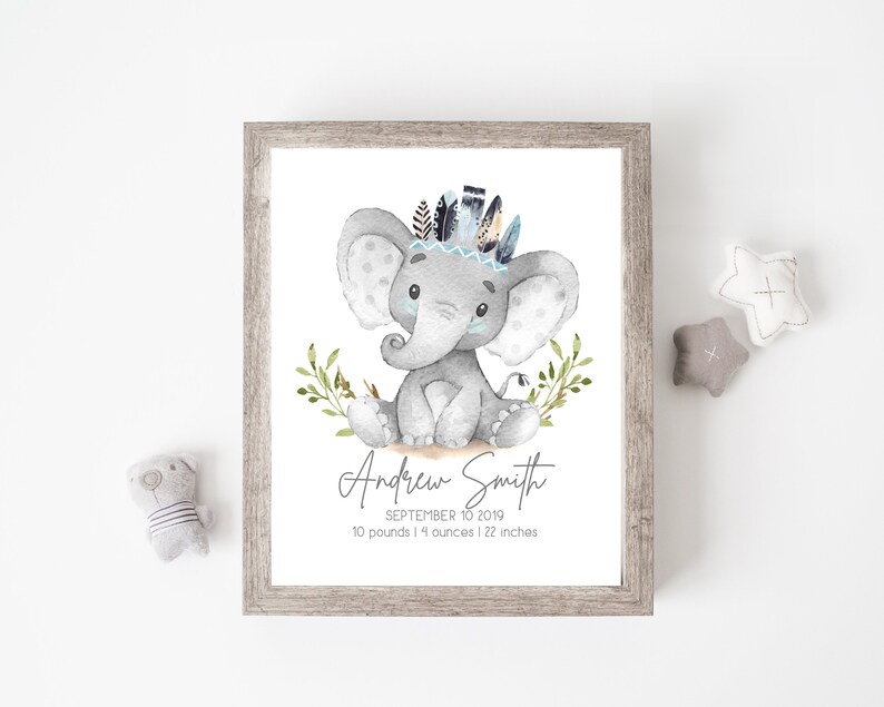 May include: A watercolor illustration of a gray elephant wearing a blue and black feather headdress. The elephant is sitting on a brown surface with green leaves. The text "Andrew Smith, September 10, 2019, 10 pounds 14 ounces 22 inches" is below the elephant.
