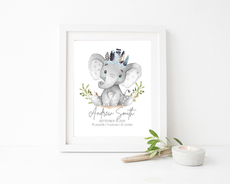 May include: A watercolor illustration of a gray elephant wearing a blue and white feather headdress. The elephant is sitting on a brown surface with green leaves. The text below the elephant reads "Andrew Smith, September 10, 2019, 10 pounds 11 ounces | 22 inches".