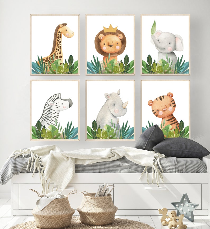 May include: Six watercolor animal prints featuring a giraffe, lion, elephant, zebra, rhinoceros, and tiger. Each animal is surrounded by green leaves and set against a white background.