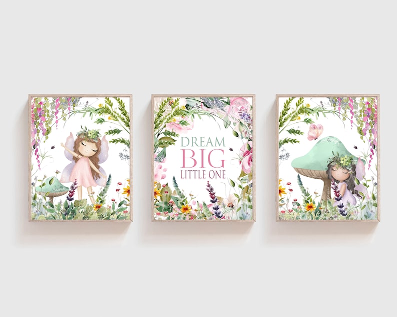 May include: Three watercolor prints featuring a fairy in a pink dress and wings, surrounded by flowers and greenery. The middle print has the text "Dream Big Little One".