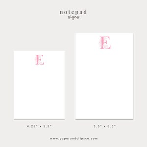 May include: Two notepad sizes with a pink floral letter E on each. The smaller notepad is 4.25 inches by 5.5 inches. The larger notepad is 5.5 inches by 8.5 inches.
