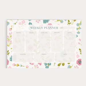 May include: A weekly planner featuring a floral design. The planner has sections for each day of the week, plus a notes area. The floral pattern is in shades of pink, blue and green.