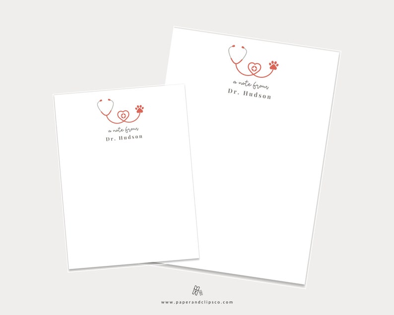 May include: Two white note cards with a red stethoscope, heart, and paw print design. The text on the cards reads "a note from Dr. Hudson".