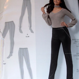May include: A sewing pattern for trousers with two different styles: a slim fit and a curvy fit. The pattern includes instructions for a bias waistband and a centre leg seam. The pattern is shown on a model wearing black trousers.