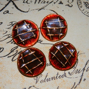May include: Four round, red and gold buttons with a woven design. The buttons have a shiny, metallic finish.