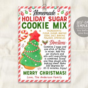 May include: Printable Christmas cookie mix gift tag with a red and white striped border. The tag features a watercolor illustration of a gingerbread cookie shaped like a Christmas tree. The text on the tag reads "Homemade Holiday Sugar Cookie Mix" and includes instructions for making the cookies. The tag also includes the text "Self-Edit Template try before you buy!"
