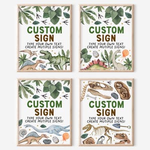 May include: Four printable signs with a dinosaur theme. Each sign has a green and brown border and features a white background with illustrations of dinosaurs, fossils, and eggs. The text on each sign reads "CUSTOM SIGN TYPE YOUR OWN TEXT CREATE MULTIPLE SIGNS!"