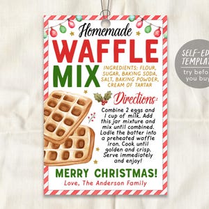 May include: A printable gift tag with a red and white striped background. The tag features a watercolor illustration of waffles and the text "Homemade Waffle Mix". The text "Merry Christmas!" is printed in green and red. The tag also includes a list of ingredients and directions for making the waffle mix.