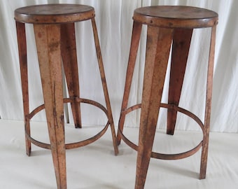 INDUSTRIAL METAL STOOLS. Pair off. Mid 20th Century.